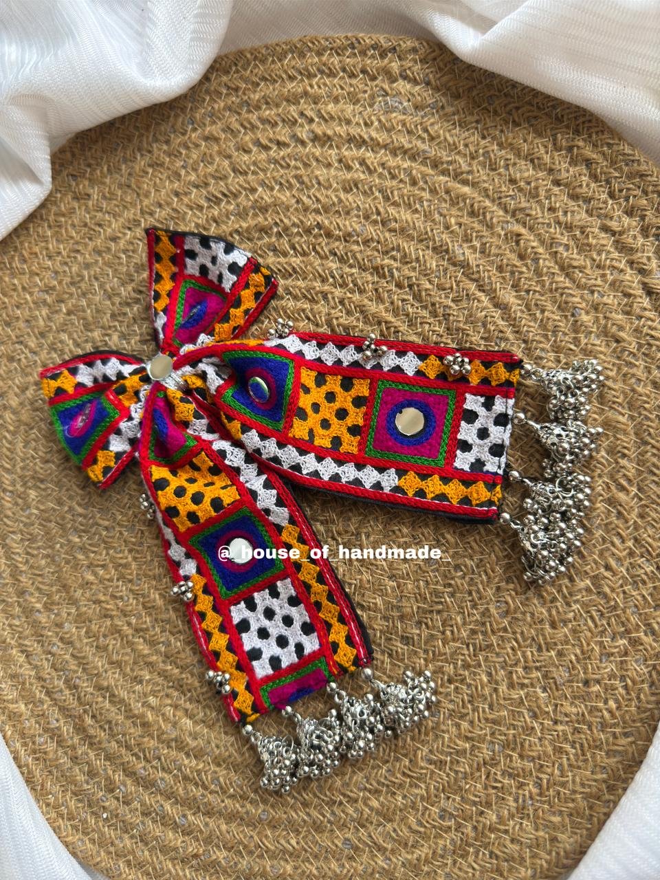 11 Handmade Vibrant Embroidered Bow Brooch with Silver Ghungroo Hangings Handmade Vibrant Embroidered Bow Brooch with Silver Ghungroo Hangings