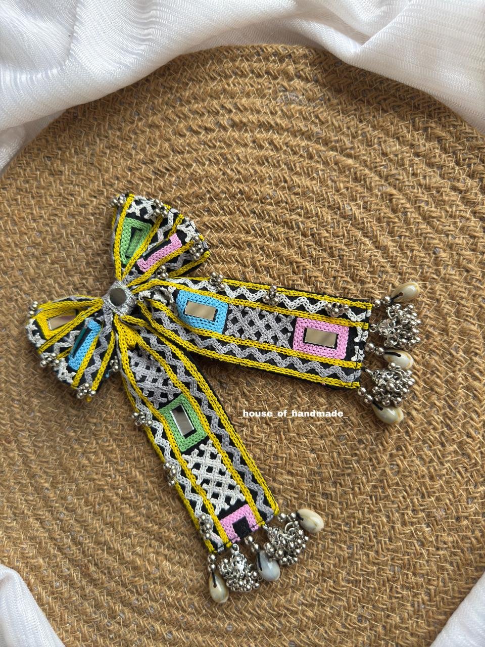 6 3 Handmade Black & Yellow Embroidered Bow Brooch with Pastel Mirror Work and Ghungroo Handmade Black & Yellow Embroidered Bow Brooch with Pastel Mirror Work and Ghungroo