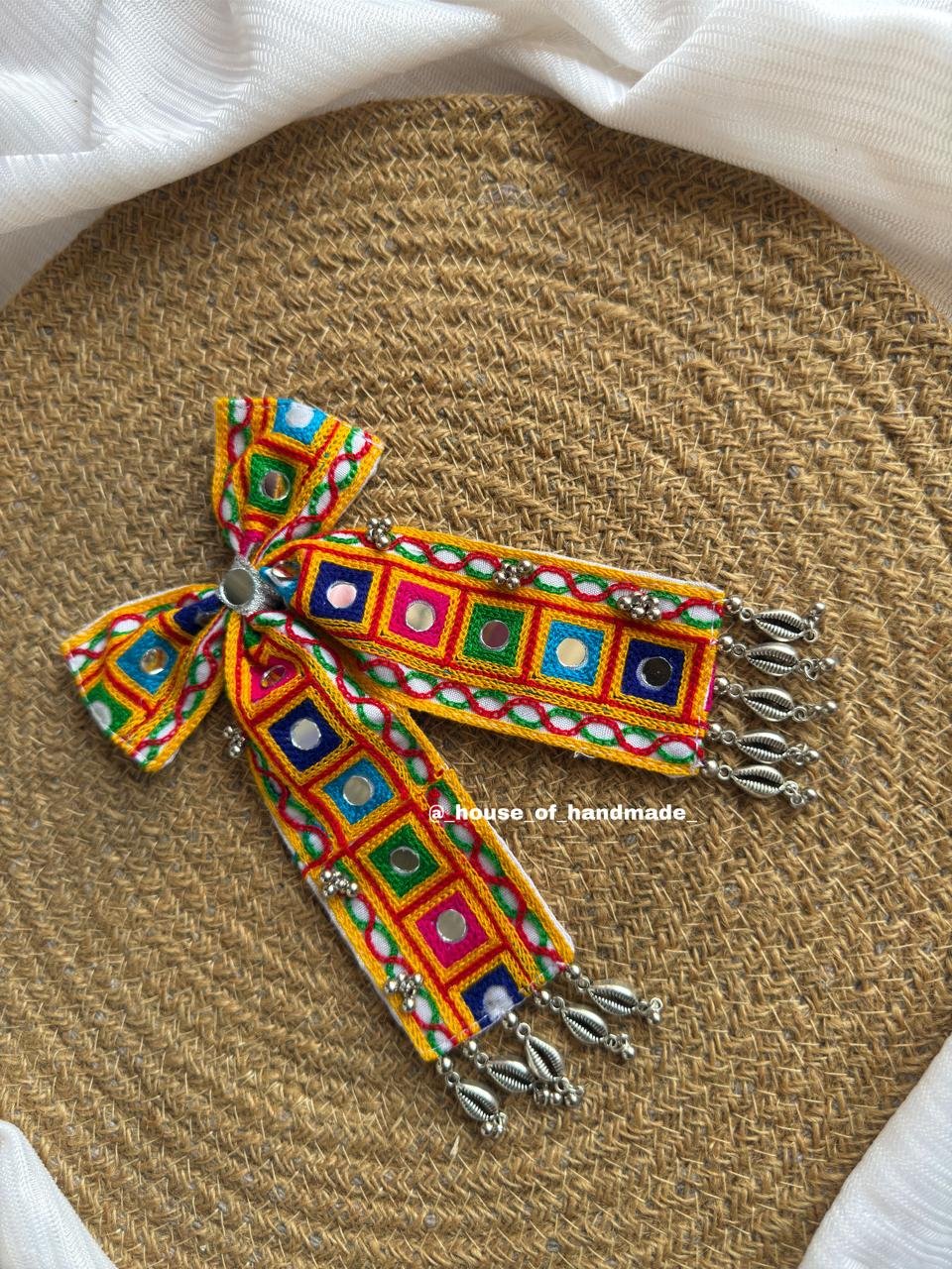 7 2 Handmade Multicolor Embroidered Bow Brooch with Mirror Work & Silver Ghungroo Handmade Multicolor Embroidered Bow Brooch with Mirror Work & Silver Ghungroo